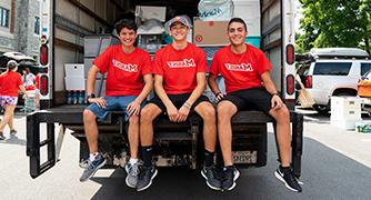 Photo of three Marist students helping with Move-in day